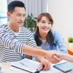 Couple Signing Mortgage